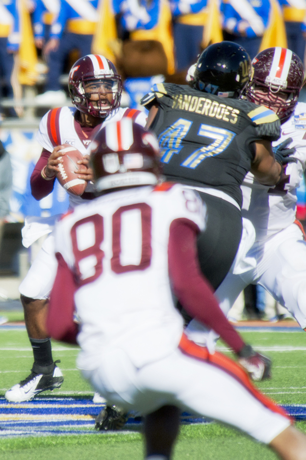 Eddie Vanderdoes (No. 47 in photo) was picked by the Oakland Raiders in the third round. He is pictured here going after the Virginia Tech quarterback during the 2013 Hyundai Sun Bowl
